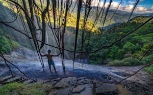 A man at the top of Knuckles Mountain Range the Fascinating Wonder of Nature in Sri Lanka